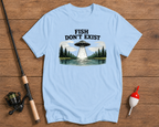 Light blue t-shirt with UFO and forest graphic, fishing rod and float on wooden surface

