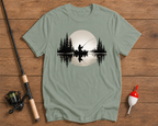 Sunset Cast fishing graphic tee in sage green featuring a fisherman on a calm lake by Funky Fish Club